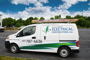 Design and Build Electrical Contractors van outside their warehouse.