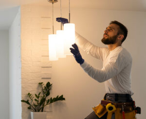 electrician working on residential home lighting fixtures